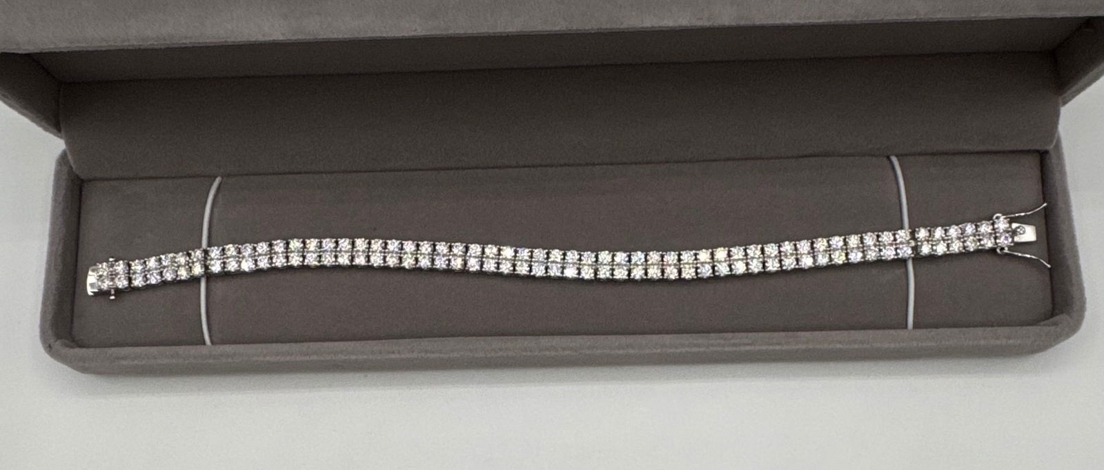 Double Row Moissanite Bracelet 18k WG Over 925: Elevate your collection with this stunning double-row tennis bracelet, featuring two parallel lines of brilliant round-cut Moissanite stones. Each stone is meticulously set in high-quality 925 sterlin