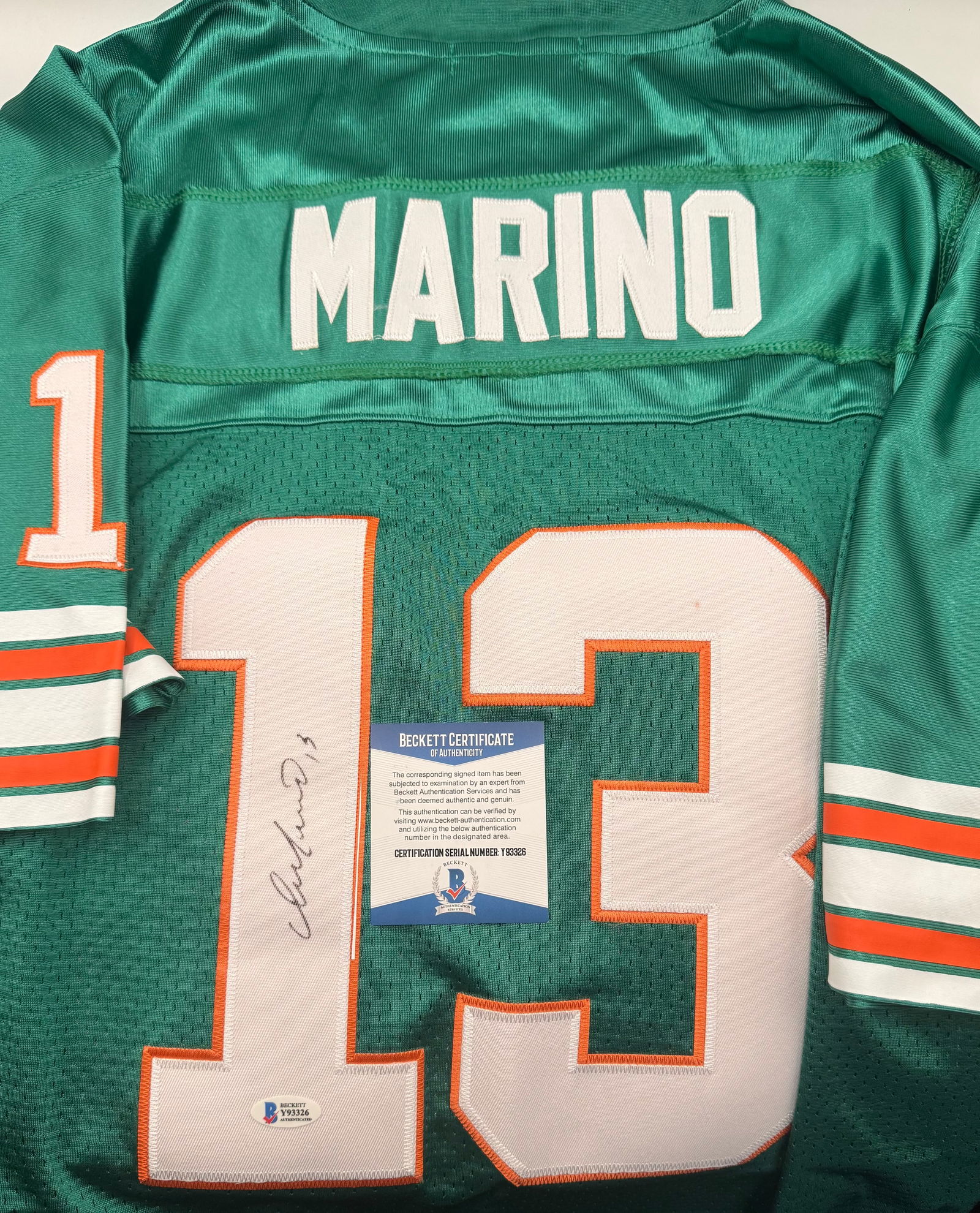 Dan Marino Signed Miami Dolphins Jersey - Beckett Authenticated: Player: Dan Marino (Hall of Fame Class of 2005)• Team: Miami Dolphins• Item: Dolphins "Aqua" home style jersey featuring the famous number 13.• Signature: Crisp, clear signature in