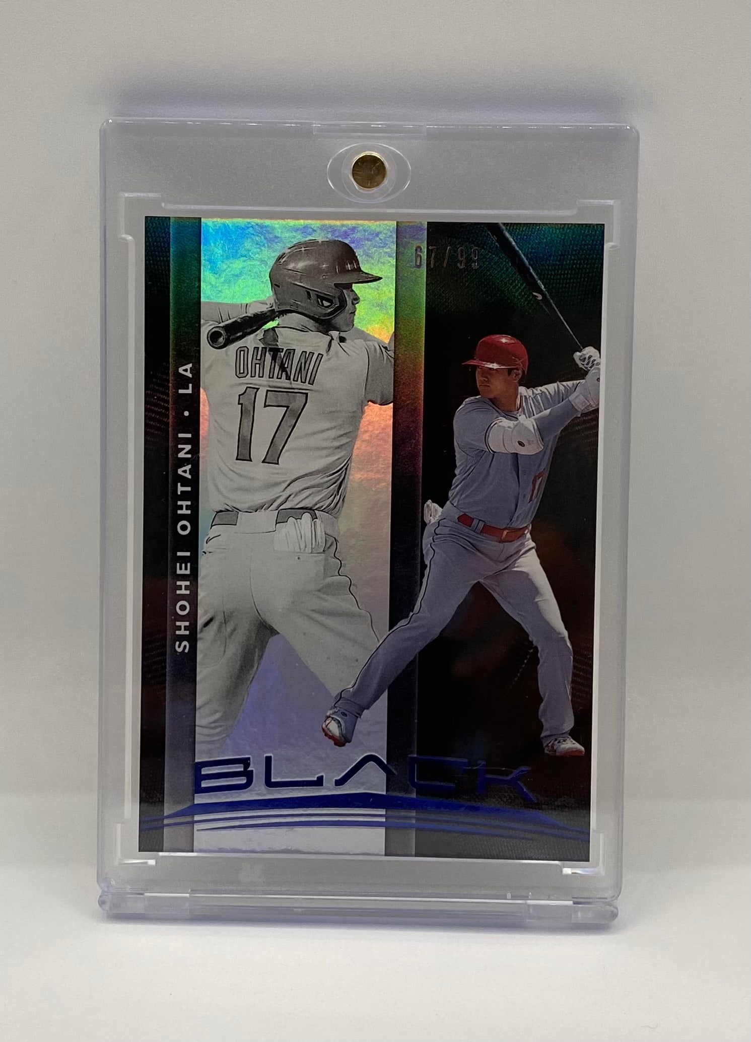 Shohei Ohtani Panini Black Metal "LA" Parallel Serial Numbered 67/99 - Rare: Player: Shohei Ohtani• Team: Los Angeles Angels (designated "LA")• Brand: Panini Black• Feature: Stunning metalized/refractor finish with dual-image design.• Serial Number: 67/99&b