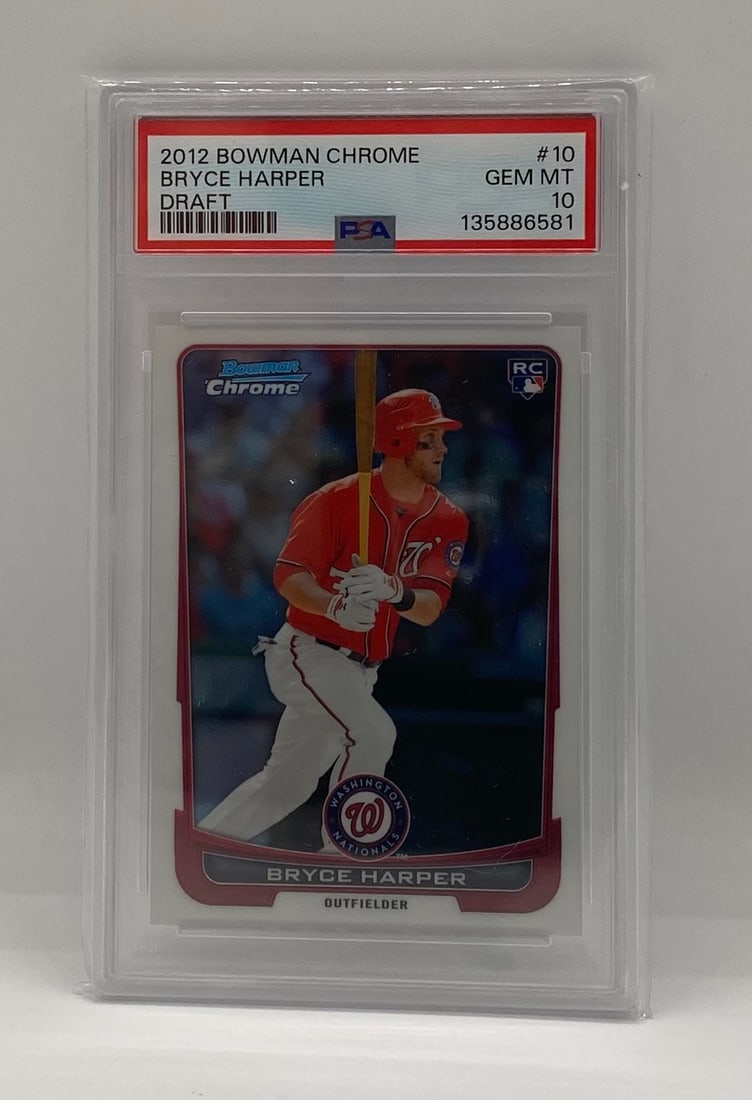 2012 Bowman Chrome Draft Bryce Harper Rookie Card: The quintessential Bryce Harper rookie card. This 2012 Bowman Chrome Draft features the 2x MVP in his Washington Nationals uniform with the "RC" logo. Graded PSA 10 Gem Mint, this is a "Blue Chip" bas