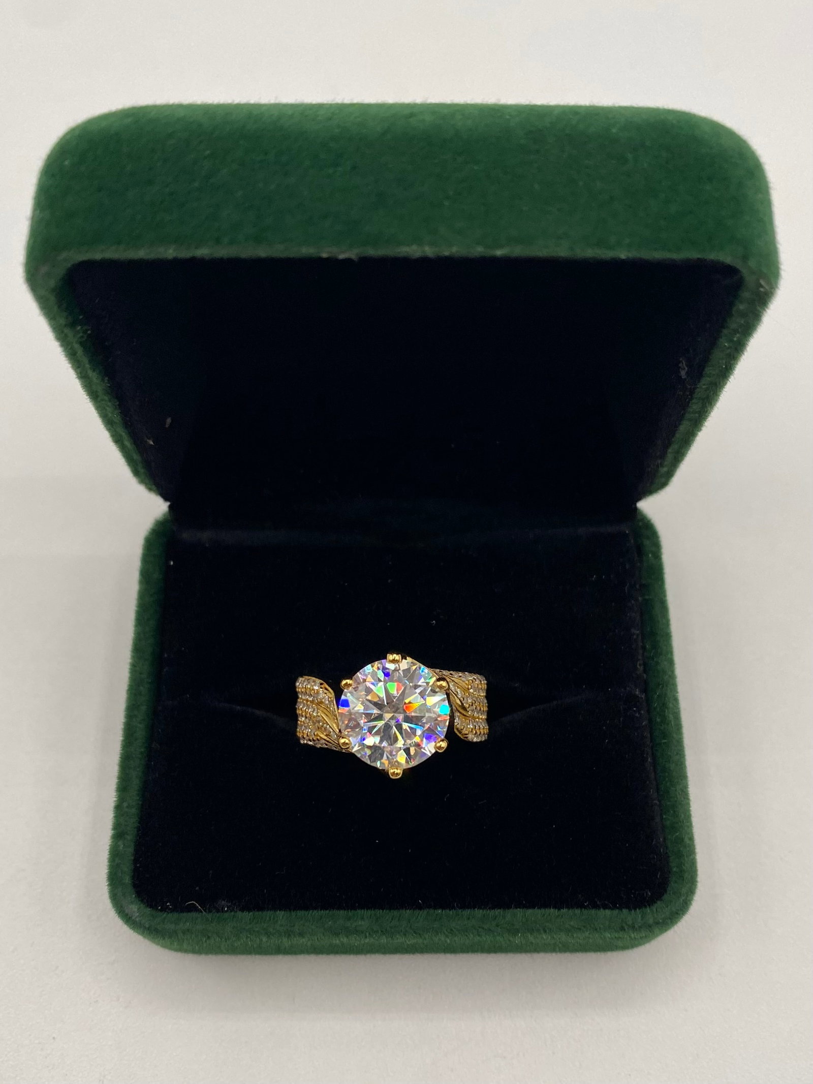 5.00CT Brilliant Round Cut Moissanite Solitaire Ring - 18K Gold Plated - GRA Certified - Size 7: Experience the fire and brilliance of this stunning 5.00-carat round brilliant cut Moissanite solitaire ring. Expertly crafted for maximum light refraction, this stone exhibits a breathtaking "rainbow