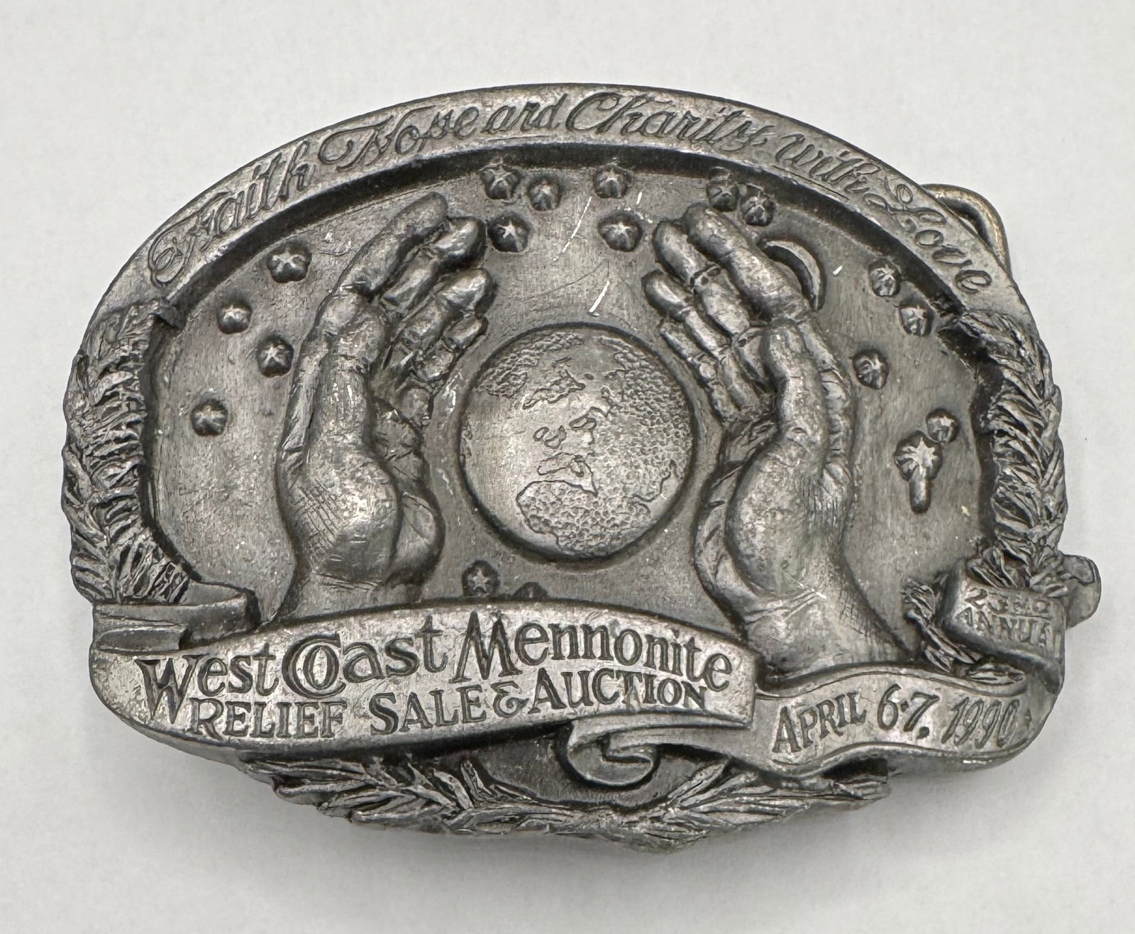 1990 West Coast Mennonite Relief Sale & Auction Belt Buckle - Limited Edition /250: This is a highly detailed, limited edition commemorative belt buckle from the 23rd Annual West Coast Mennonite Relief Sale & Auction, held on April 6–7, 1990. This piece was produced as part of a fu