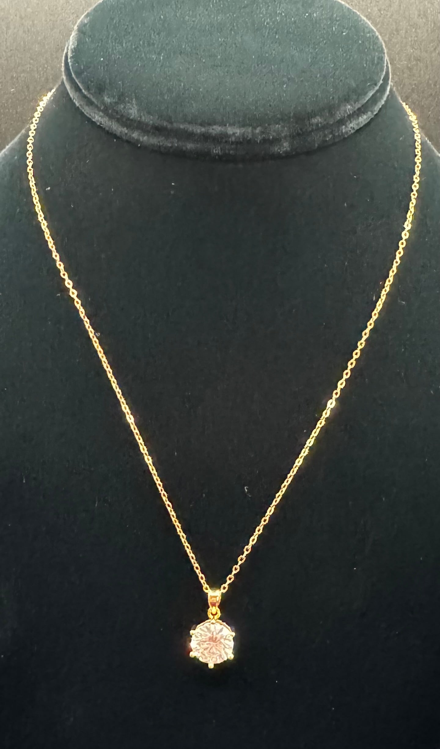 4.00ct Classic Round Brilliant Cut Moissanite Solitaire Necklace: Main Stone: 4.00 Carat Round Brilliant Cut Moissanite• Color: Clear/White• Metal: 18K Gold Plated over Sterling Silver• Testing: Professionally tests positive for diamond on standard th