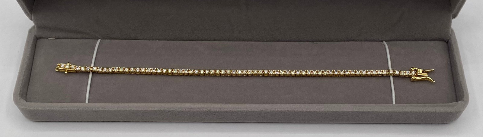 7" D Color VVS1 Moissanite Tennis Bracelet: Gemstone Type: Authentic Moissanite• Clarity Grade: VVS1• Color Grade: D (Colorless)• Stone Size: 2mm (Approx. 0.03 carats per stone)• Bracelet Length: 7 Inches• Clasp Type: S