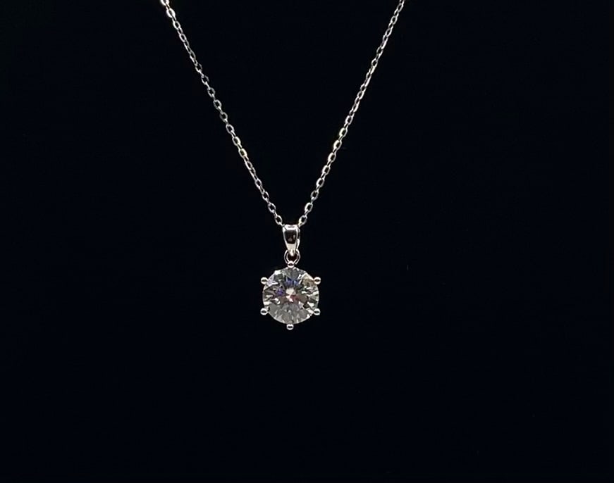 4.00 CT Round Cut Moissanite Solitaire Necklace 18K White Gold Plated: Stone Type: Genuine Moissanite Carat Weight: 4.00 Carats Stone Cut/Shape: Round Brilliant Cut Setting: Classic 6-Prong Solitaire Setting Metal Composition: 18K White Gold Plated over Solid Sterling