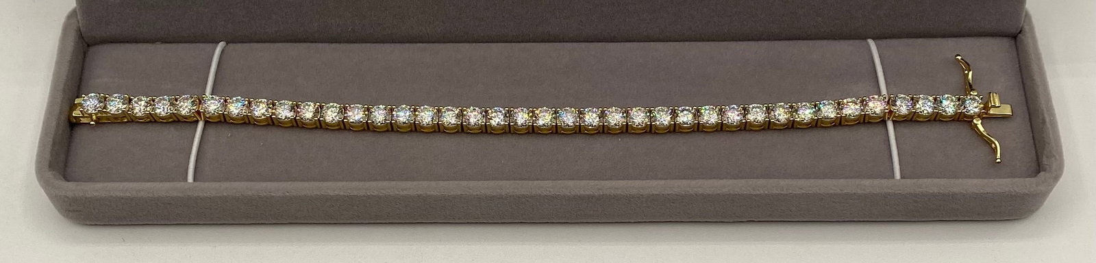 VVS Moissanite 18K Gold Plated Sterling Silver 8" Tennis Bracelet: Elevate your collection with this classic, high-brilliance classic tennis bracelet, designed to offer the ultimate diamond-like fire and scintillation at an exceptional value. Gemstone: Premium VVS Cl