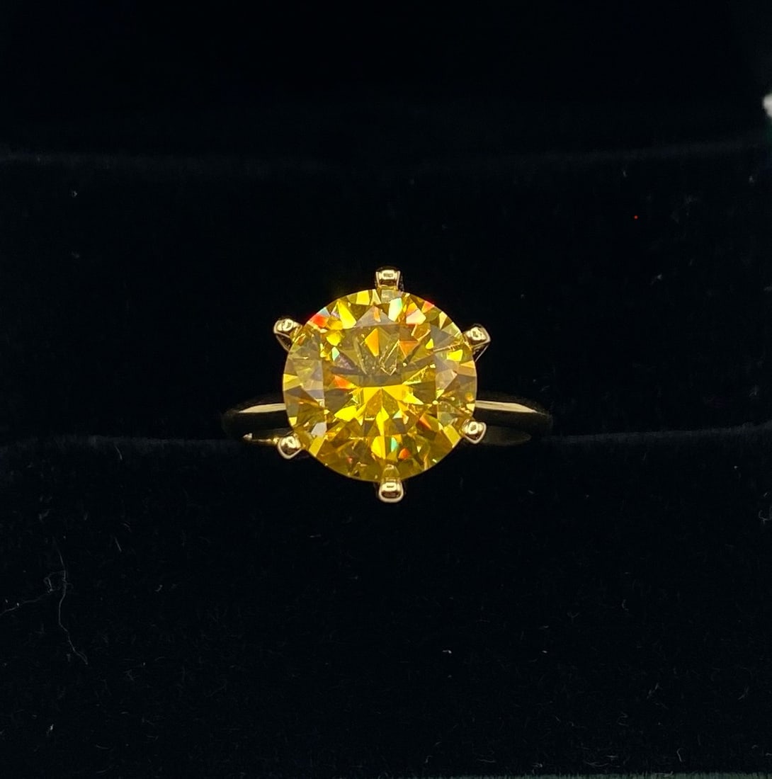 Gold Yellow 5 Carats Moissanite VVS1 Ring: 18k Gold Plated Over Sterling Silver Ring with Gold Yellow VVS1 Moissanite Stone . Ring size: 7 1/2 . It comes with a certificate of authenticity.