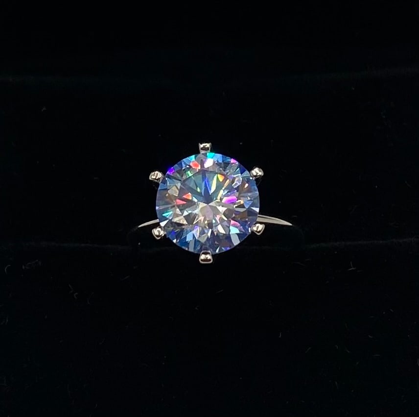 Blue 5 Carats Moissanite VVS1 Ring Size 7: 18k Gold Plated Over Sterling Silver Ring with Blue VVS1 Moissanite Stone . Ring size: 7 . It comes with a certificate of authenticity.