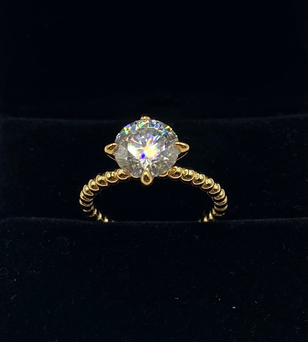 3 Carats Moissanite VVS1 Ring Size 7.5: 18k Gold Plated Over Sterling Silver Ring with Colro D VVS1 Moissanite Stone . Ring size: 7 1/2 . It comes with a certificate of authenticity.