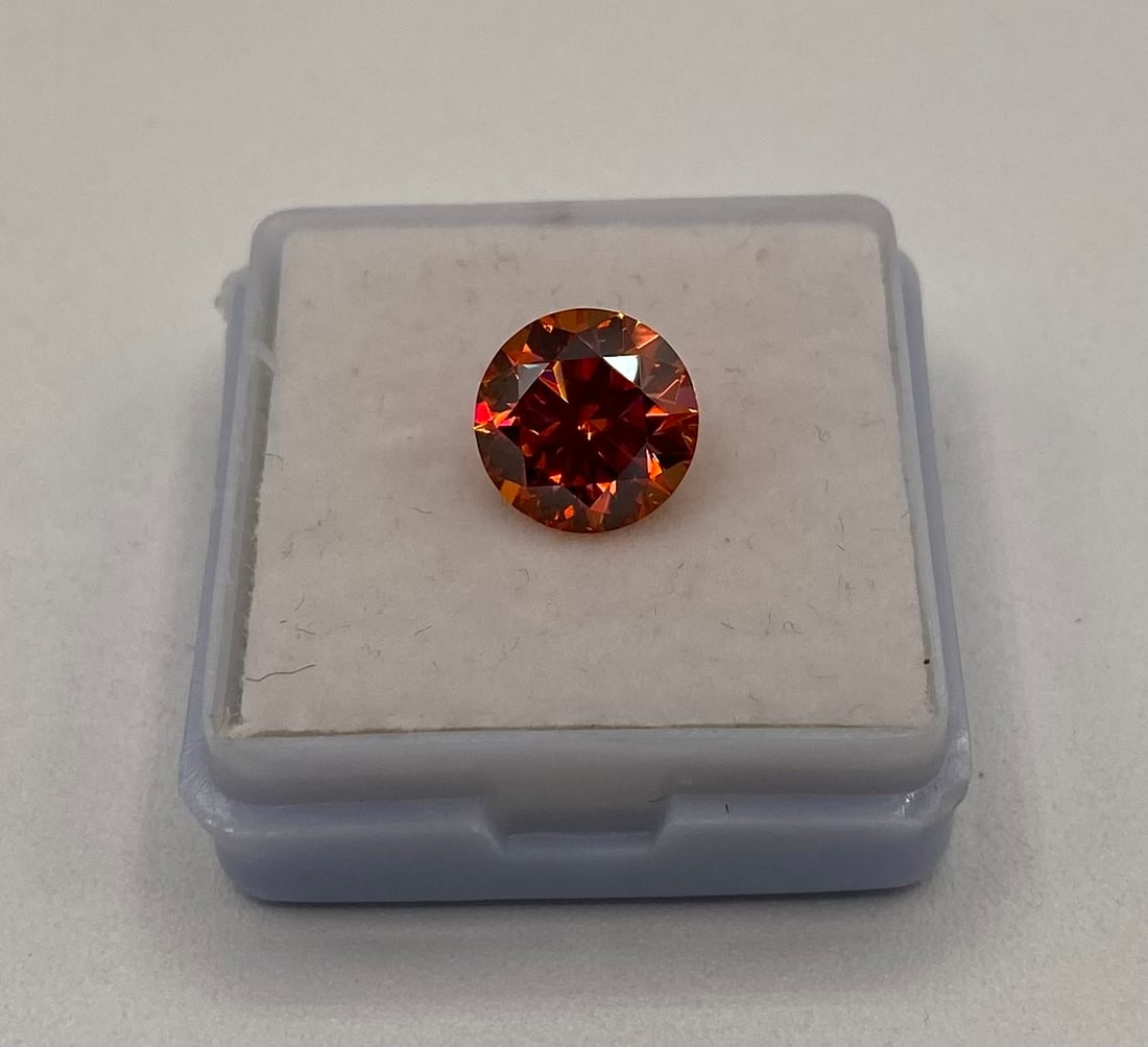 3 Carats Garnet VVS1 Moissanite Stone: 3 Carats Garnet color VVS1 Moissanite Stone. It passes for diamond using diamond tester . It comes with a certificate