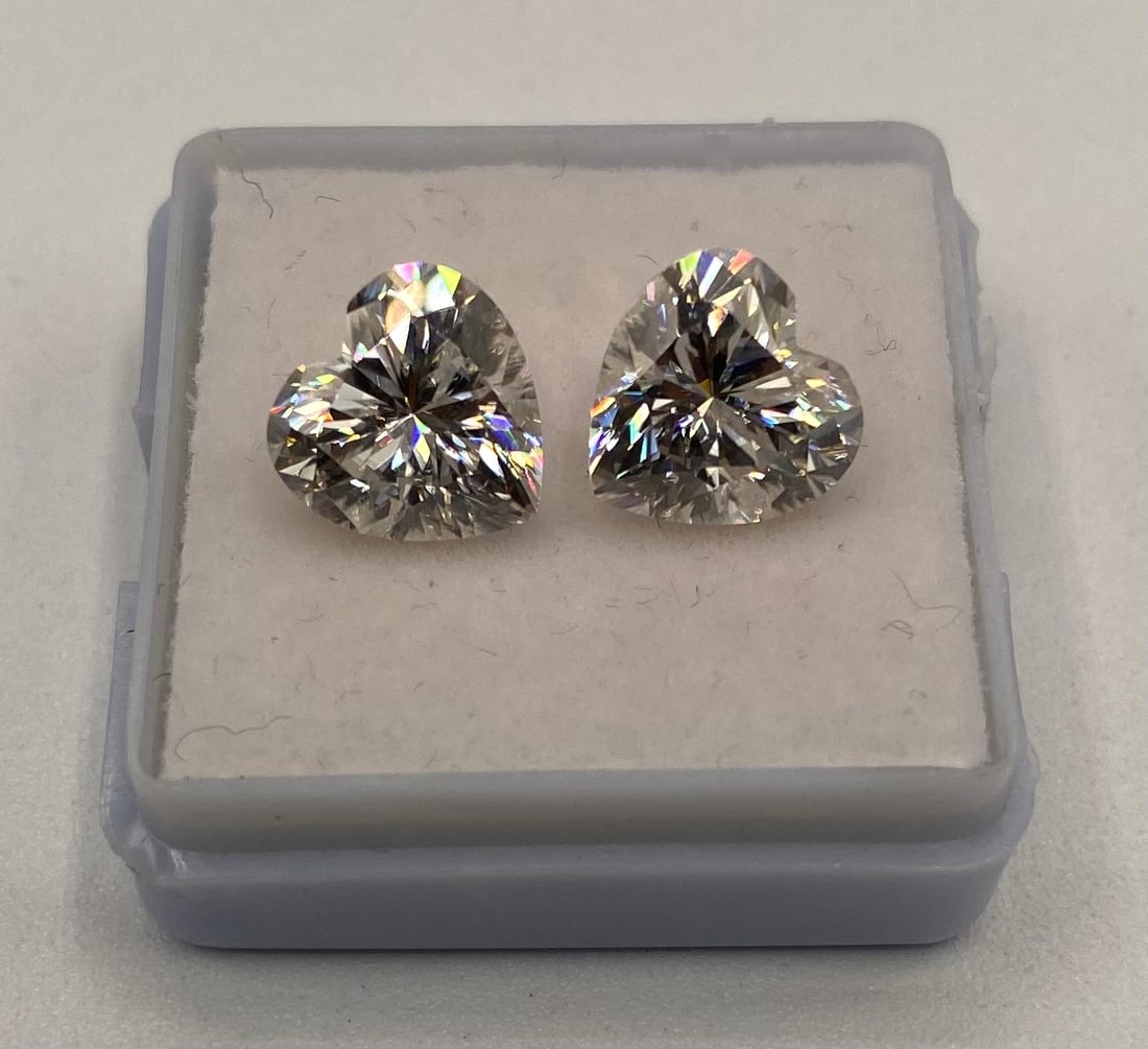 6 Carats Heart Shapes VVS1 Moissanite Stone (2): (2) two 3 Carats D Color heart shapes VVS1 Moissanite Stone. It passes for diamond using diamond tester . It comes with a certificate