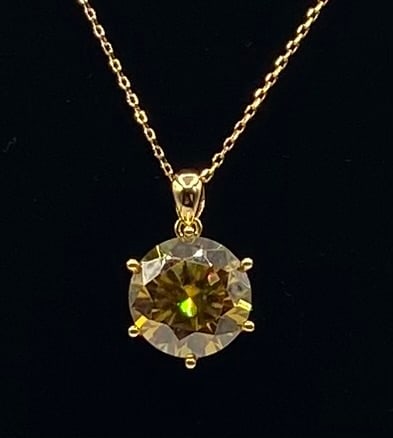 10 Carats Yellow VVS1 Moissanite Necklace: 18k gold plated on sterling Silver with 10 Carats Yellow Color VVS1 Moissanite Stone. It passes for diamond using diamond tester . It comes with a certificate
