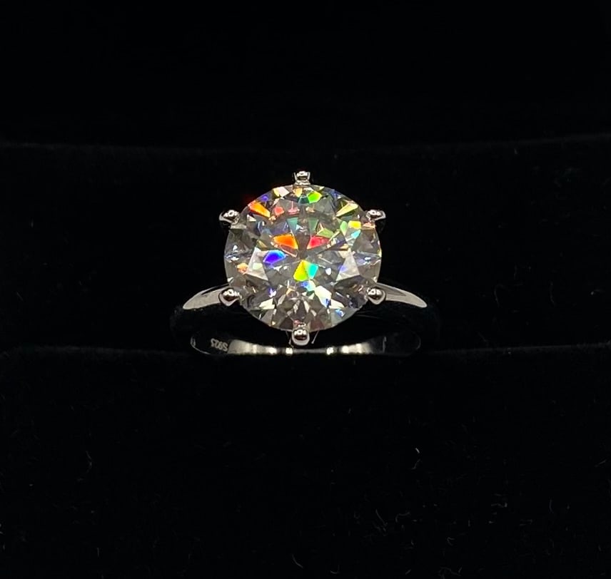 5 Carats VVS1 Moissanite Ring: 18k gold plated on sterling Silver Ring with 5 Carats D Color VVS1 Moissanite Stone. It passes for diamond using diamond tester . It comes with a certificate