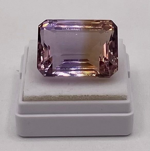 27.21 Cts Natural Bicolor Ametrine: Variety: Natural Ametrine Species / Group: Quartz Weight: 27.21 Cts Color: Violet / Yellow Shape / Cut: Octagon / Step Dimensions: 19.94 x 14.95 x 11.67 mm Refractive Index: 1.540 - 1.55 Biref 0.010