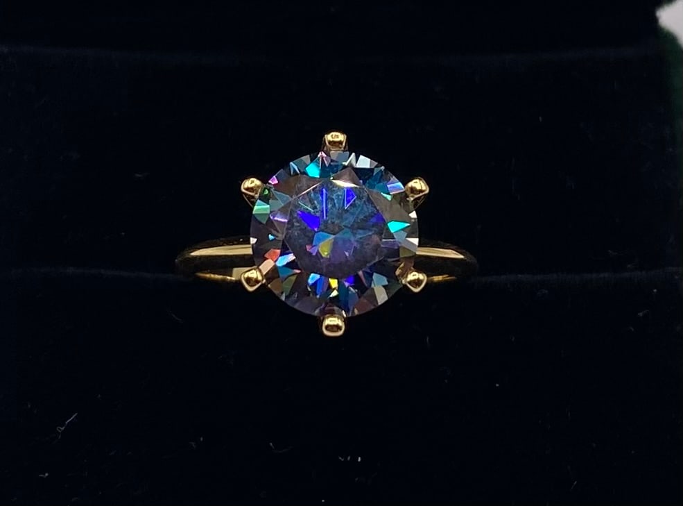 5 Carats Purple Color VVS1 Moissanite Ring 18K Yellow Gold Plated Sterling Silver Ring: 10.00 CT Rainbow Purple VVS1 Round Moissanite Statement Ring 18K Yellow Gold Plated Sterling Silver - Size 8 1/5 (W/ Certificate)Total Carat Weight: 10.00 CTW Main Stone: Genuine Moissanite Stone