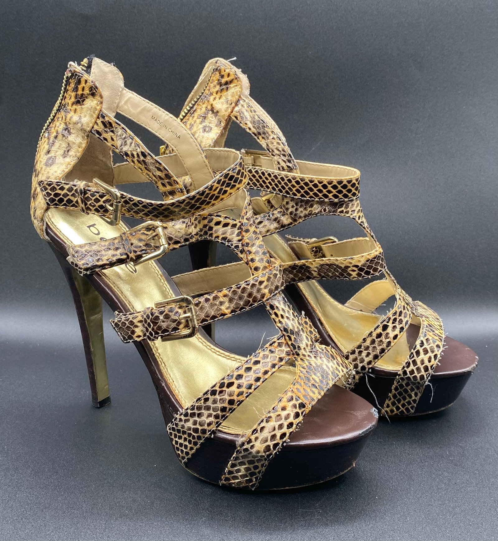Bebe "Elyse" Snakeskin Print Multi-Strap Platform Heels: Up for auction is a fierce pair of Bebe "Elyse" Platform Heels in a striking natural brown and tan snakeskin print. Designed with caged multi-strap vamps, gold-tone accent buckles, rear zipper closure