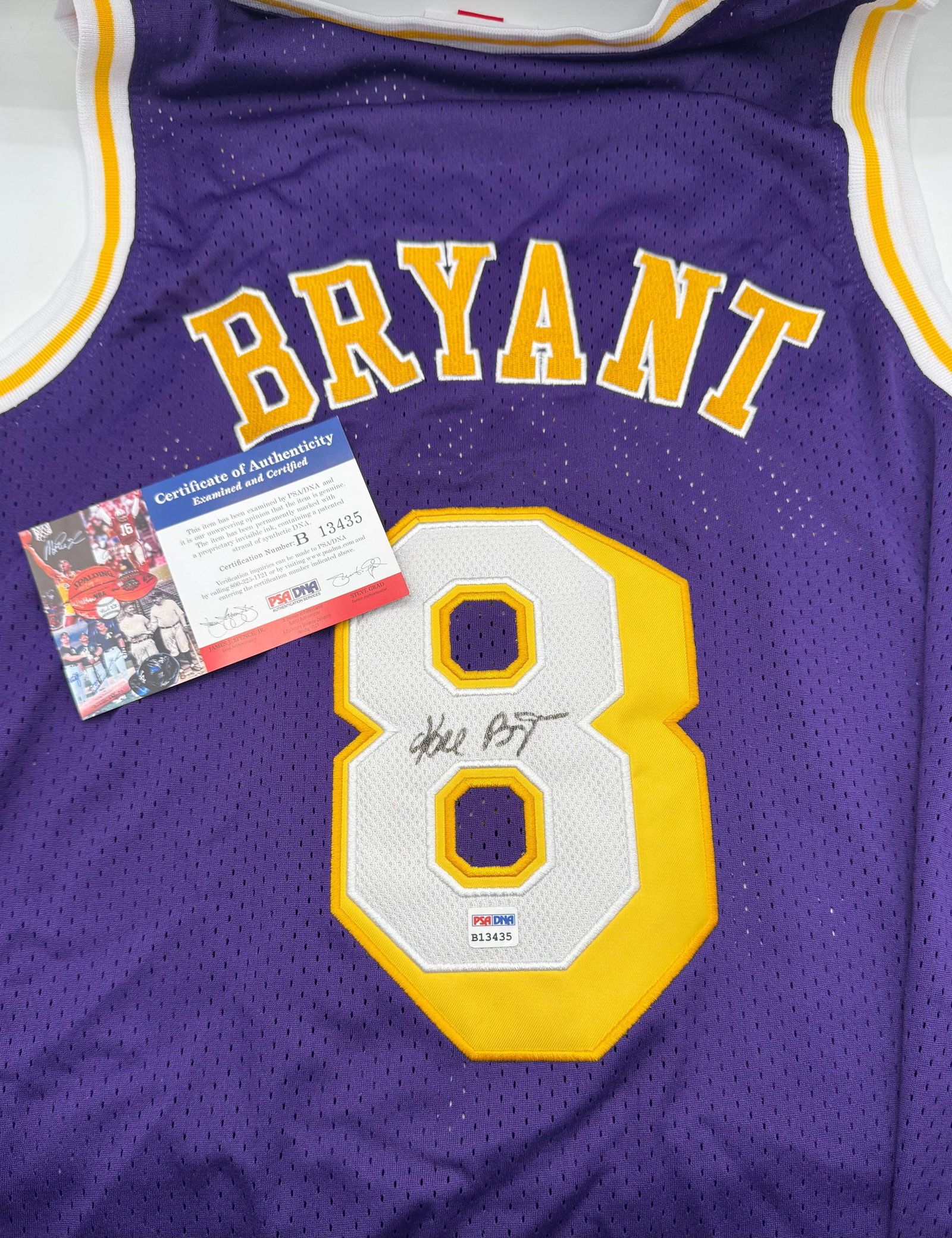 Kobe Bryant Signed Los Angeles Lakers #8 Jersey - PSA/DNA COA: Autographed Kobe Bryant #8 Los Angeles Lakers purple jersey. Features a hand-signed signature on the number block. Includes a PSA/DNA Certificate of Authenticity card and matching tamper-evident stick