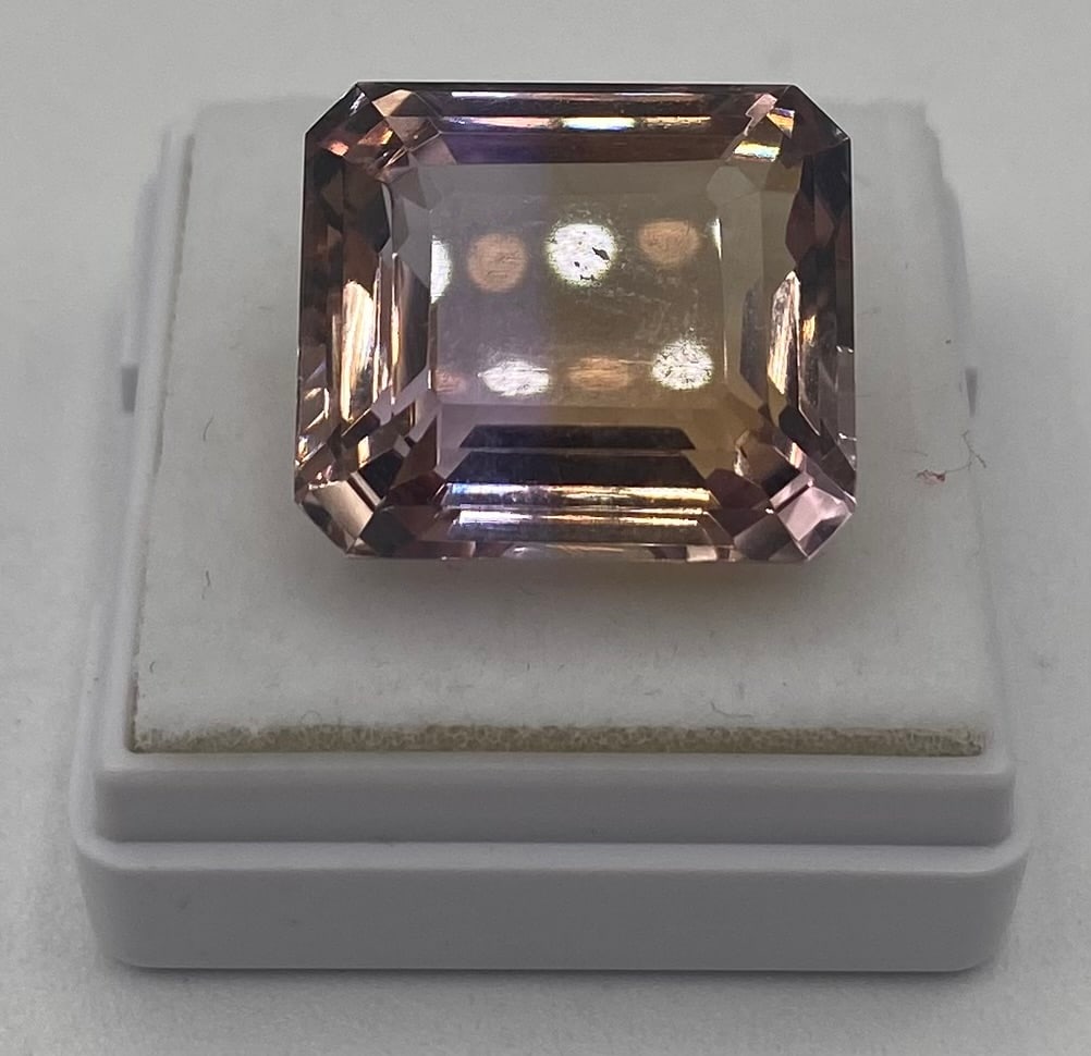 19.24 Cts Certified Natural Bicolor Ametrine: Gemstone: Natural Ametrine Species/Group: Quartz Weight: 19.24 Cts Color: Violet / Yellow Shape/Cut: Octagon / Step Cut Dimensions: 16.61 x 14.42 x 10.49 mm Refractive Index: 1.540 - 1.55 Birefringenc