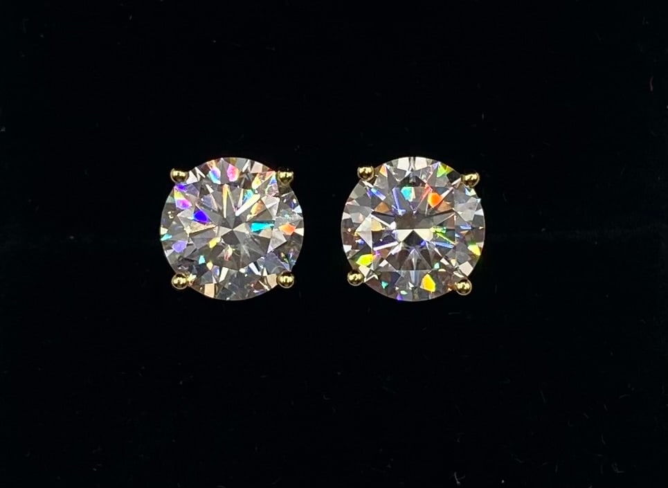 10 Carats VVS1 Moissanite Earrings Certified: Total Carat Weight: 10.00 CTW (5.00 Carats per stone) Stone Type: Lab-Created Moissanite (Passes Thermal/Diamond Tester) Color Grade: D Clarity Grade: VVS1 Metal Composition: 18K Gold Plated over 925 