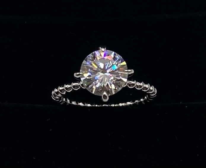 Sparkling 3 Carats VVS Ring: Total Carat Weight: 3.00 Carats Gemstone: Lab-Created Moissanite Stone Color: D (Colorless) Clarity: VVS1 (Virtually Flawless) Metal: 18K Gold Plated over 925 Sterling Silver Ring Size: 8 7 (US) Testi