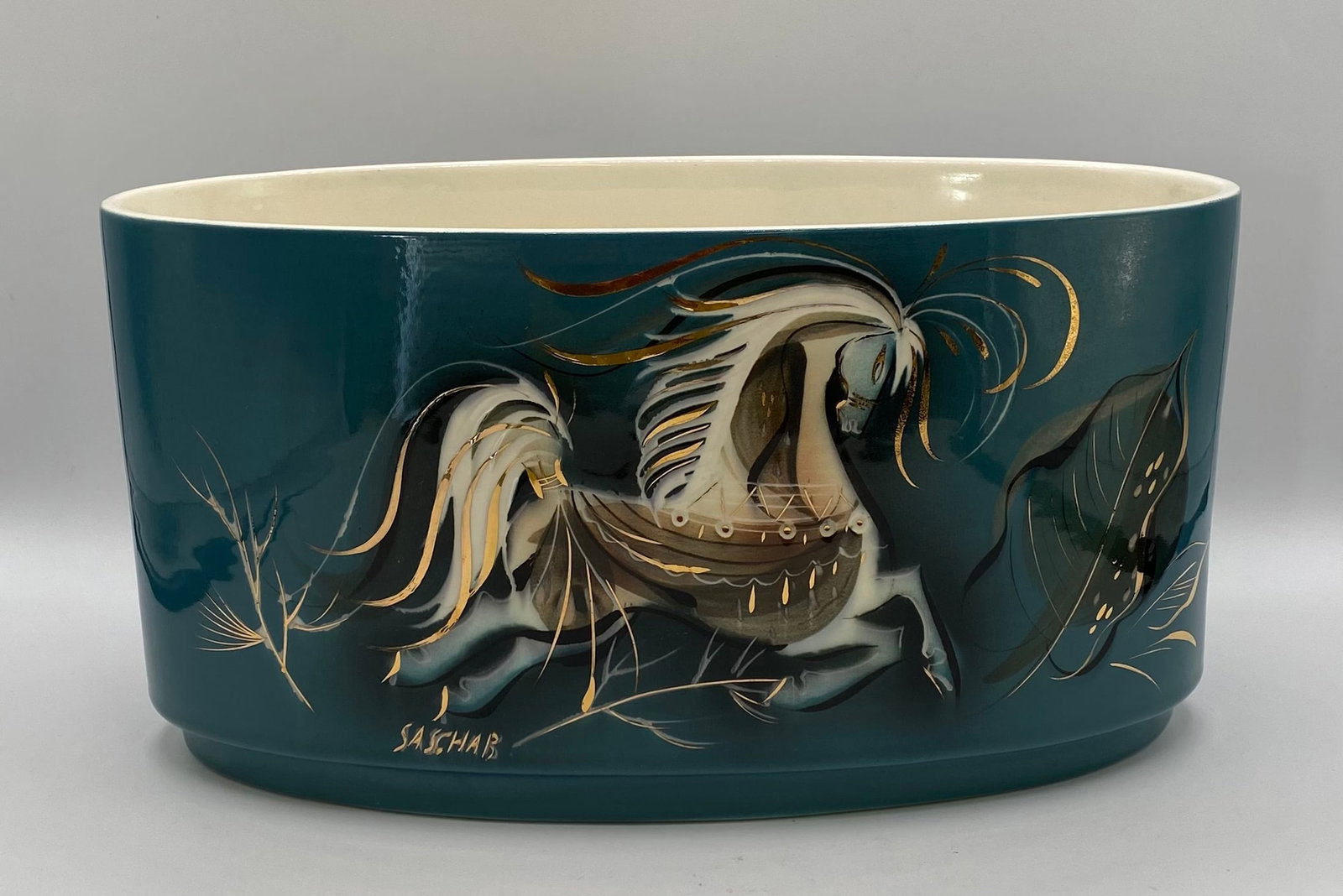 Mid-Century Modern Sascha Brastoff "Star Steed" Teal Oval Planter Bowl: A striking Mid-Century Modern California art pottery oval planter/bowl by Sascha Brastoff, featuring his signature "Star Steed" motif in brilliant gold leaf and white enameling against a rich teal blu