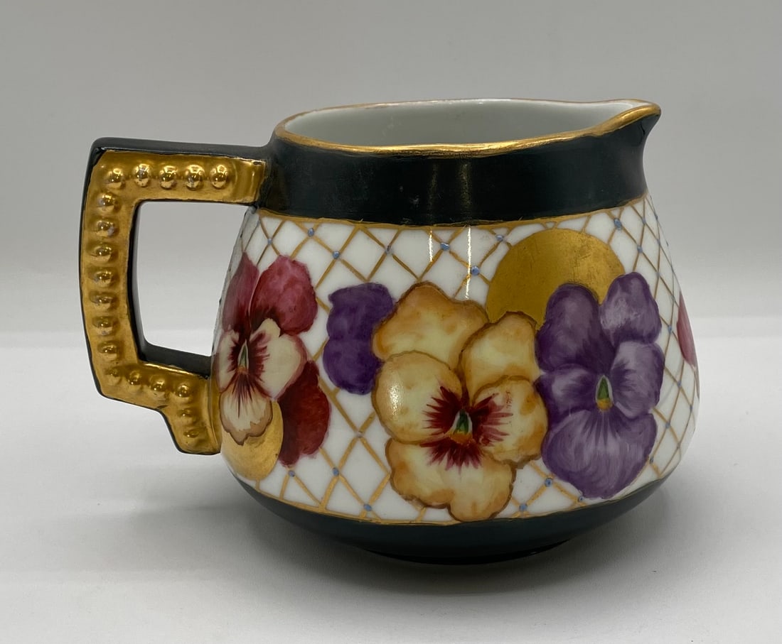 Antique Hand-Painted Porcelain Creamer Pitcher w/ Pansies & Gilt Accents,: Up for auction is an antique hand-painted porcelain creamer pitcher featuring vivid hand-painted pansy blossoms over a gold trellis lattice pattern with turquoise enamel dot accents. Framed by matte b