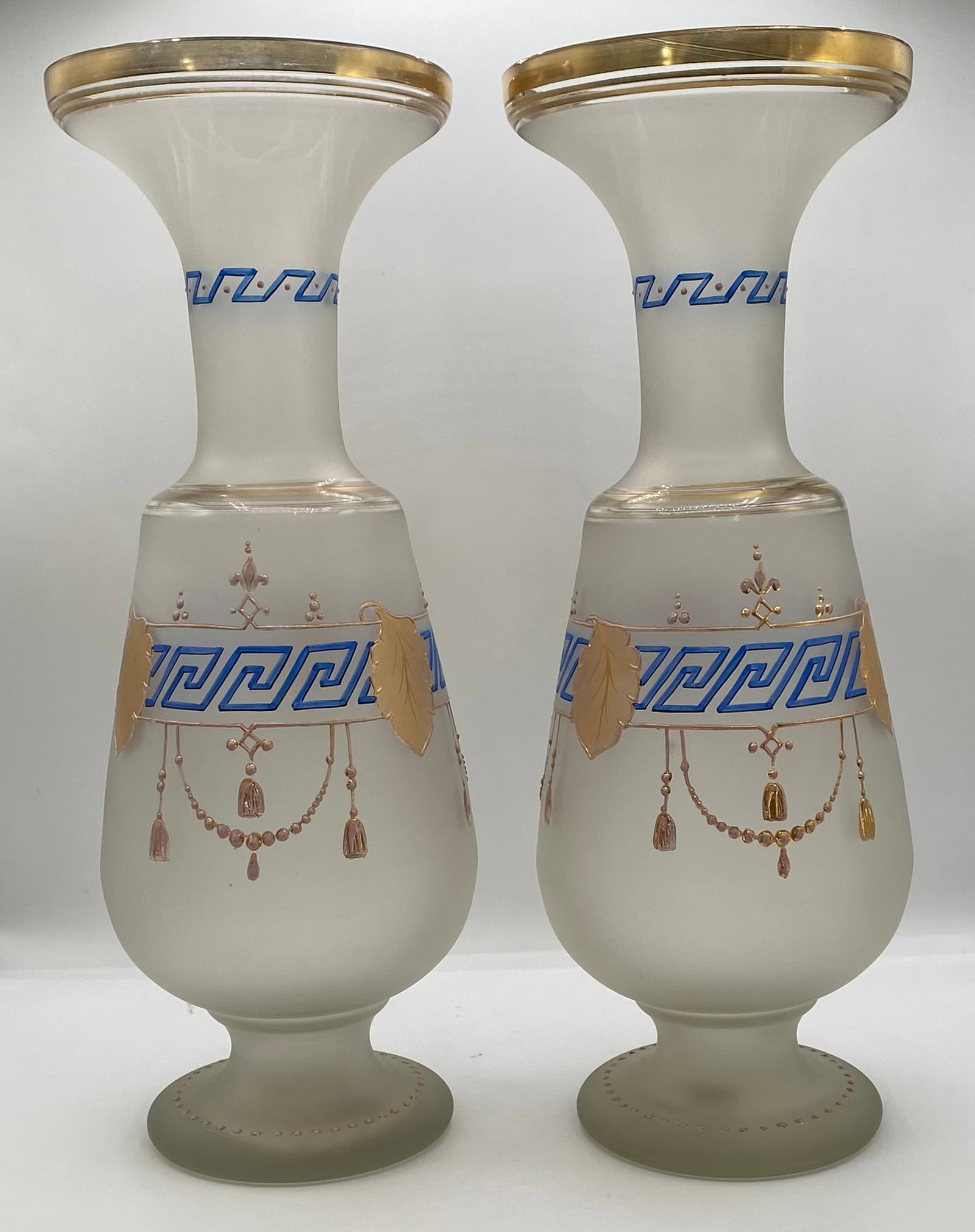 Pair of Victorian Hand-Decorated Frosted Glass Vases w/ Greek Key & Enamel: Up for auction is an elegant pair of antique Victorian-era frosted satin glass urn-form vases. Each vase features hand-enameled blue Greek key (meander) bands along the neck and body, embellished with