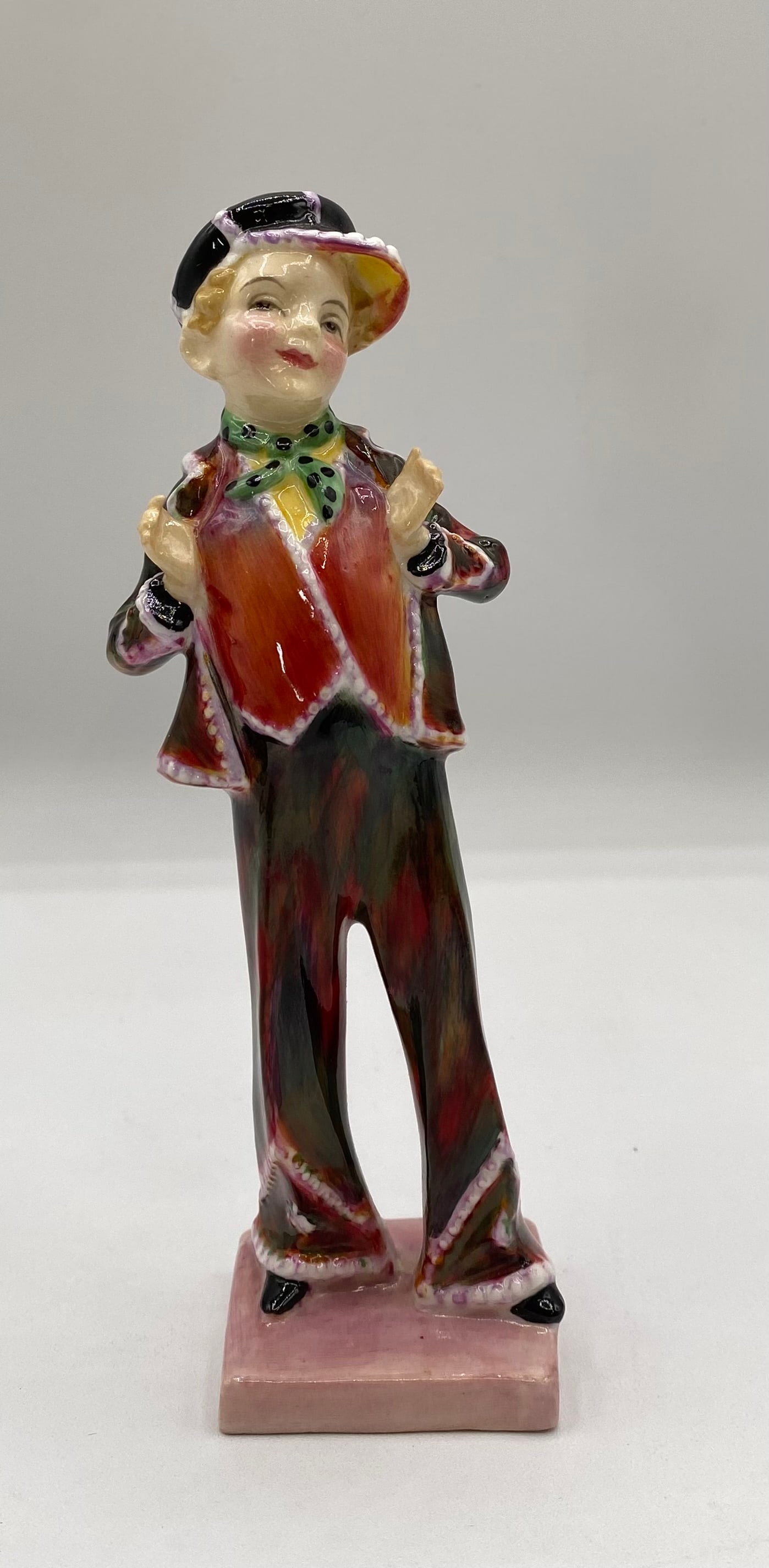 Royal Doulton Porcelain Figurine "Pearly Boy" HN 1482: Up for auction is an authentic vintage Royal Doulton hand-painted porcelain figurine titled "Pearly Boy", model HN 1482. Designed by Leslie Harradine, this detailed figure depicts a young London Pearl