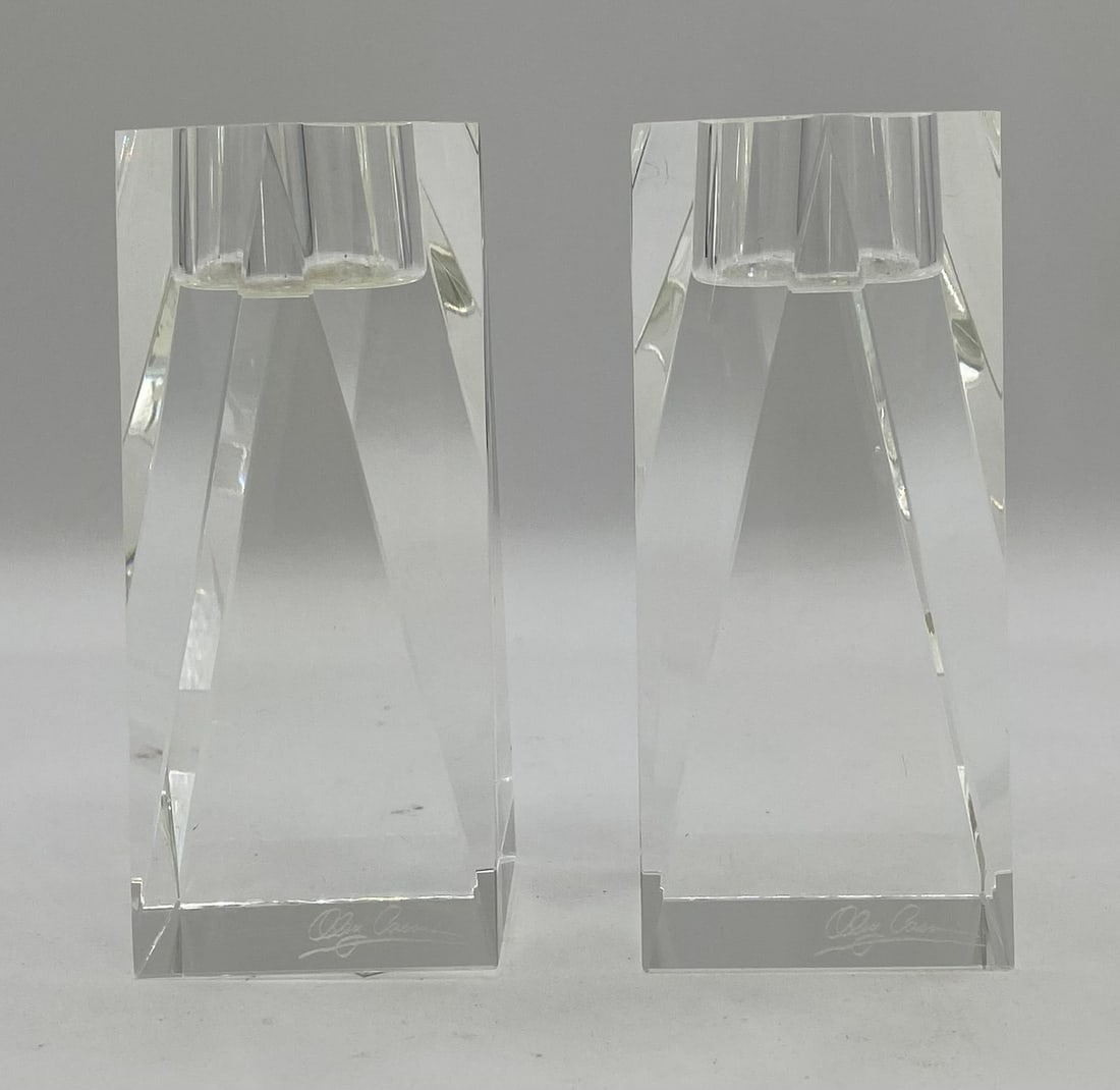 Pair of Oleg Cassini Signed Crystal Square Geometric Candle Holders: Up for auction is a matching pair of modern cut lead crystal candle holders designed by Oleg Cassini. Designed in a solid architectural block silhouette with clean bevel-cut corners and an indented ce