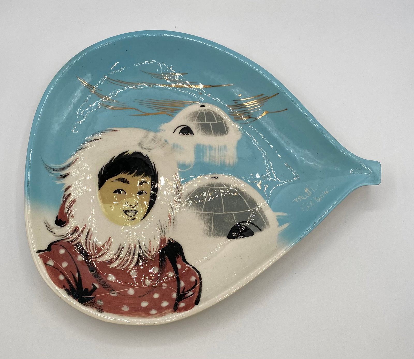 Milton Adams Hand-Painted Teardrop Ceramic Dish "Inuit Girl": Up for auction is a large vintage mid-century teardrop-shaped ceramic ash dish / tray hand-painted by artist Milton Adams. Features an Inuit child in a parka standing against igloos and ice fields und
