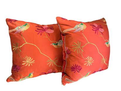 Pair of Vintage Orange Embroidered Silk Bird Pillows: Pair of vintage orange silk pillows with embroidery depicting flowers and birds finished with velvet backing and silk cord trim. DIMENSIONS: 22" x 22". CONDITION: Overall Good. There are some loose th