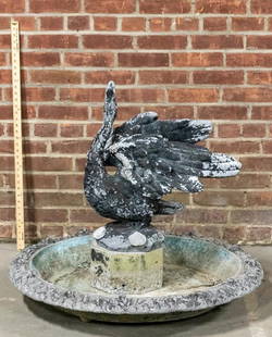 Swan Fountain: An antique lead swan fountain. The fountain comes in three pieces: a pump, a base, and the lead swan. DIMENSIONS: 36"W x 36"D x 31"H. CONDITION: Excellent.