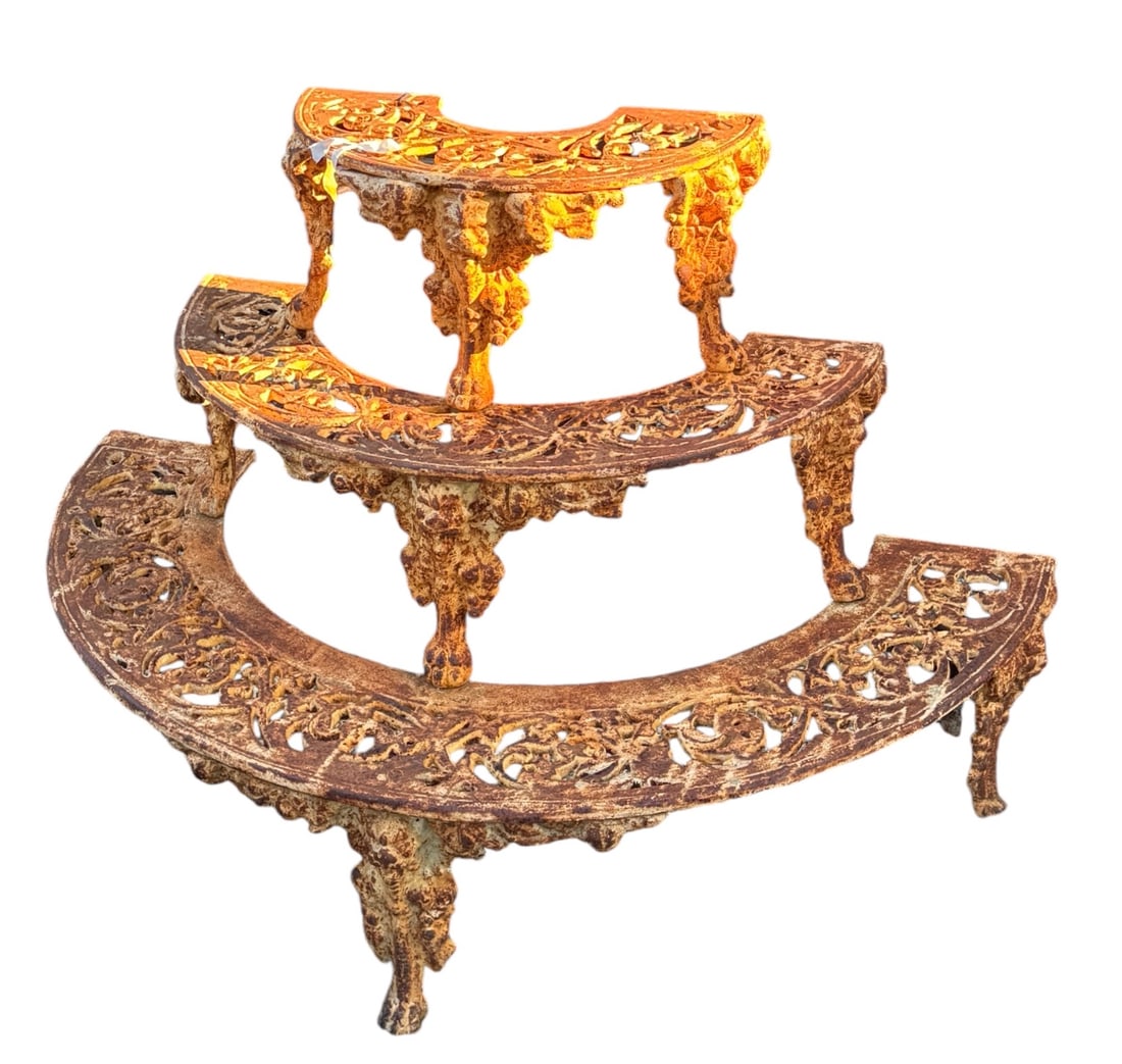 An antique tiered iron Victorian plan stand: An antique tiered iron Victorian plan stand. DIMENSIONS: 45"W x 32.5” D x 30"H