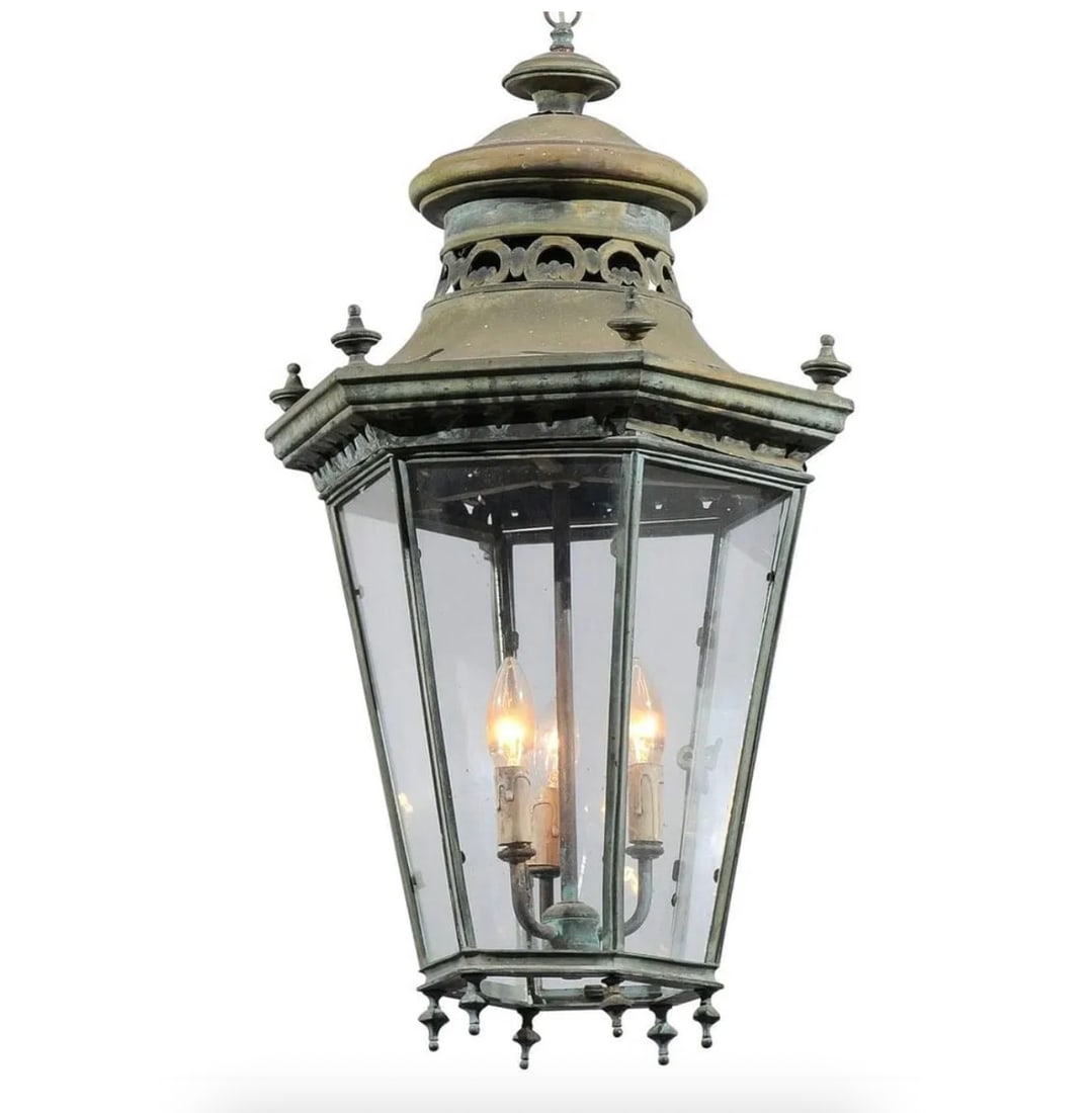 An antique three-light hexagonal verdigris copper lantern with a pagoda-shaped roof: An antique three-light hexagonal verdigris copper lantern with a pagoda-shaped roof. DIMENSIONS: 17”D x 27”L.