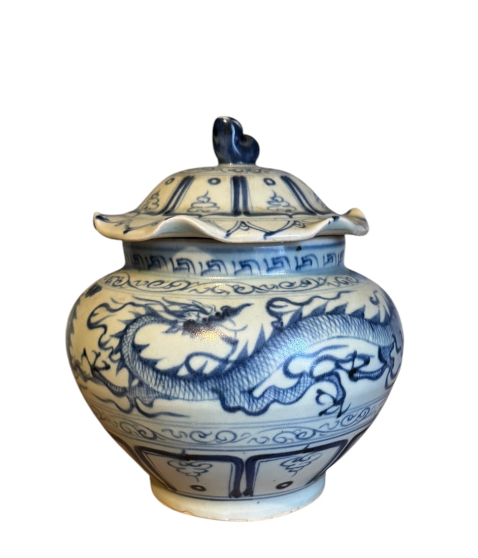 An antique Chinese blue and white dragon vase with a ruffled melon lid: An antique Chinese blue and white dragon vase with a ruffled melon lid. DIMENSIONS: 7"W x 7"D x 7.5"H