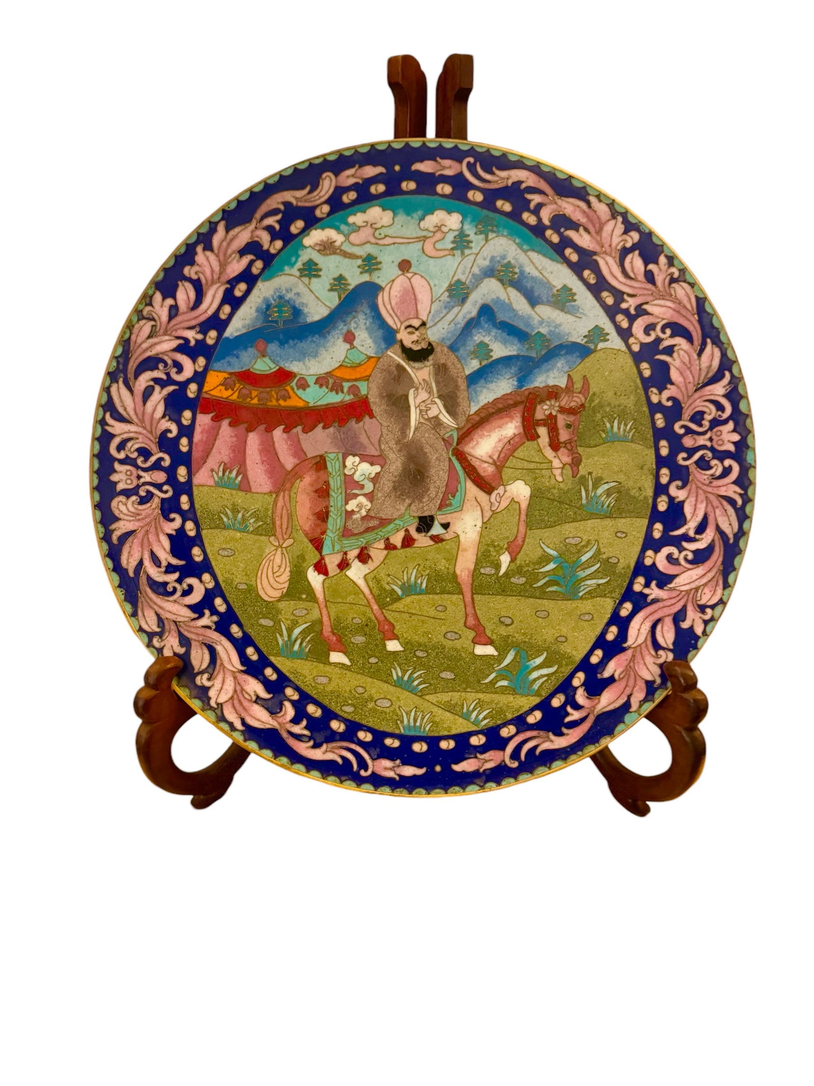 A rare antique cloisonne plate of an Ottoman horse rider: A rare antique cloisonne plate of an Ottoman horse rider. Stand included. DIMENSIONS: 12"D x 1”H. This item is located in NYC.