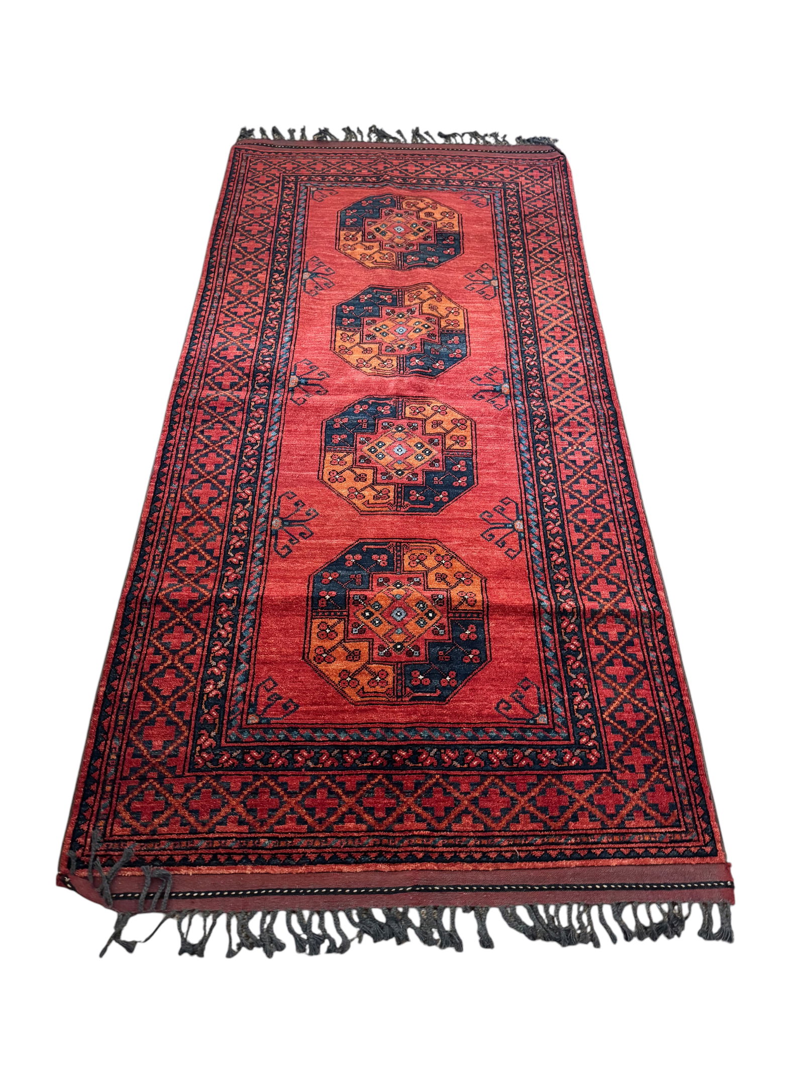 Red Turkish rug: Red Turkish rug. DIMENSIONS: 46.5"W x 99"L