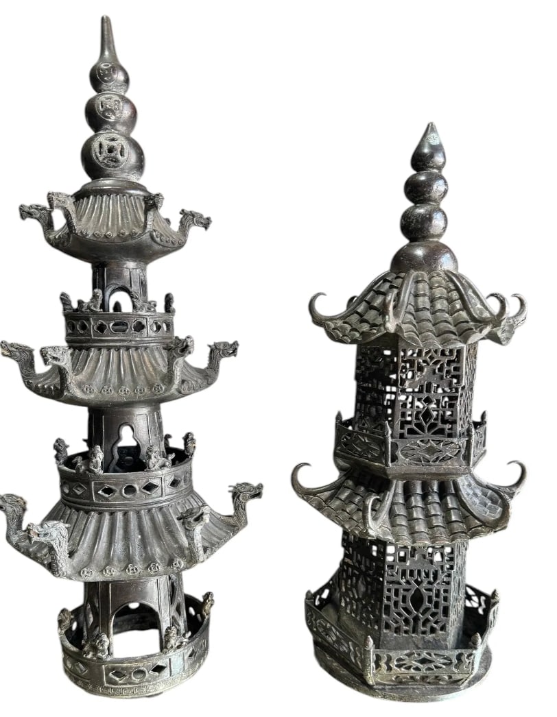 Pair of antique Chinese finely detailed his and her bronze pagodas: Pair of antique Chinese finely detailed his and her bronze pagodas. DIMENSIONS: Tall pagoda 14.25"H x 3.25"D Base x 5.6"D at largest projection. Short Pagoda 12.5"H x 4.25"D Base x 5.25"D at largest p