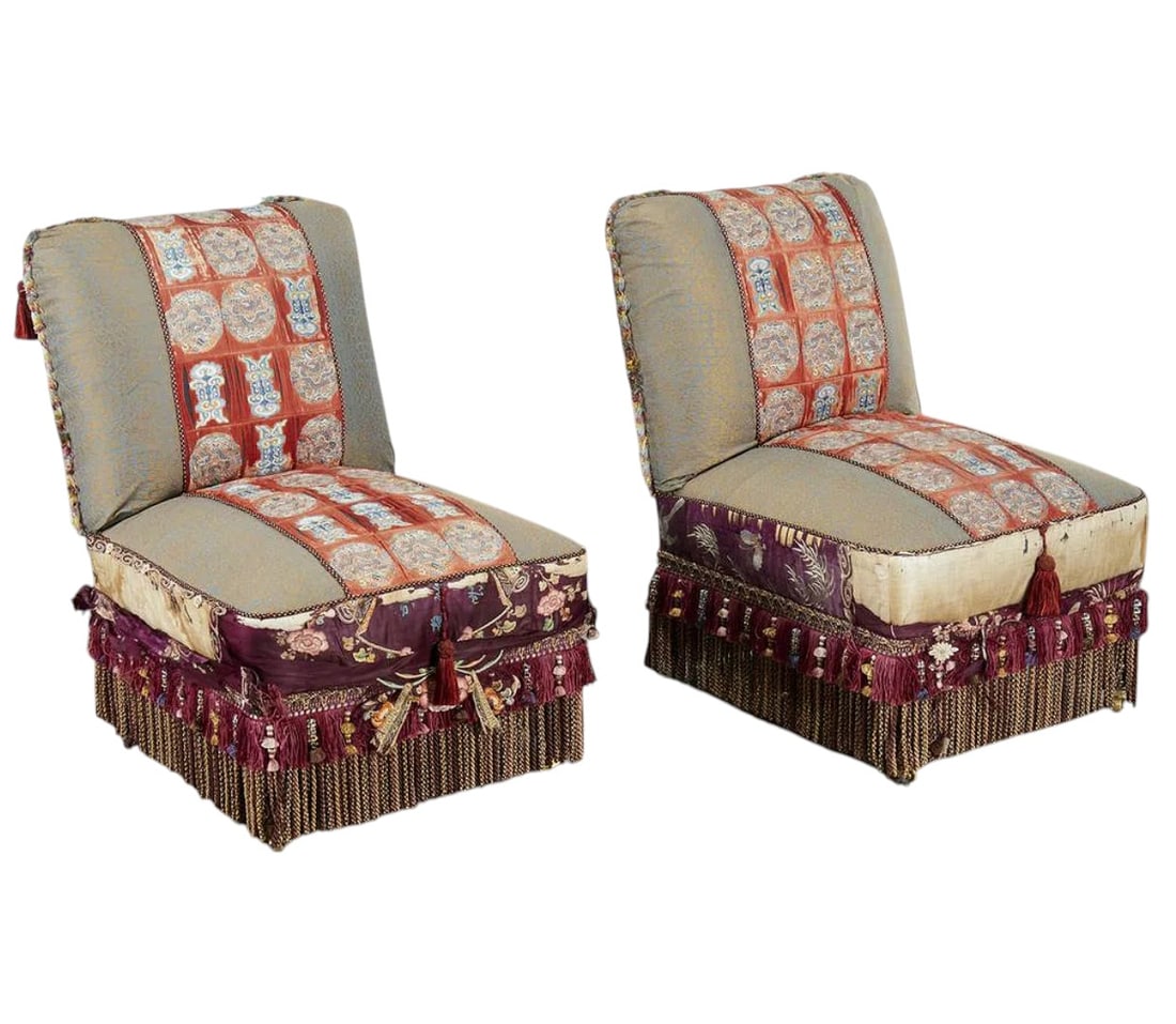 Pair Muriel Brandolini style slipper chairs, 20th c.: Pair Muriel Brandolini style slipper chairs, 20th c., nice pair fully upholstered slipper chairs, upholstered with panels of silk embroidery across front and along apron, with braided tassel skirt, ov
