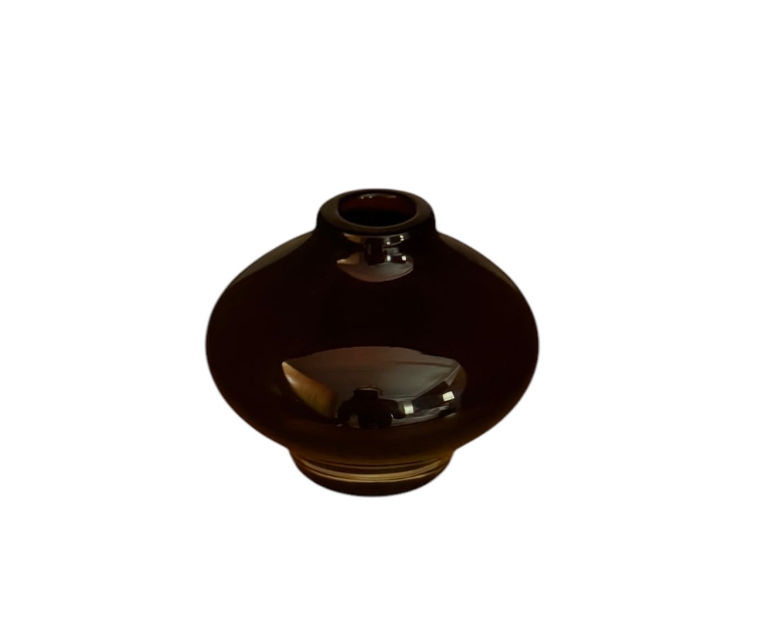 Amethyst glass bud vase: Amethyst glass bud vase. DIMENSIONS: 2"W x 2"D x 3.75"H
