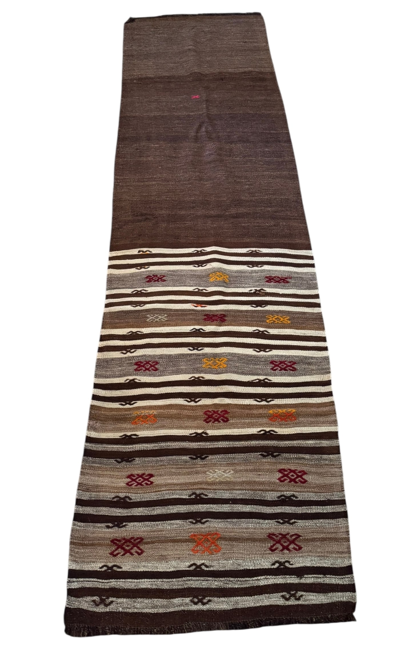 Vintage brown Turkish kilim: A vintage brown Turkish kilim. DIMENSIONS: 30”W x 105.5”L