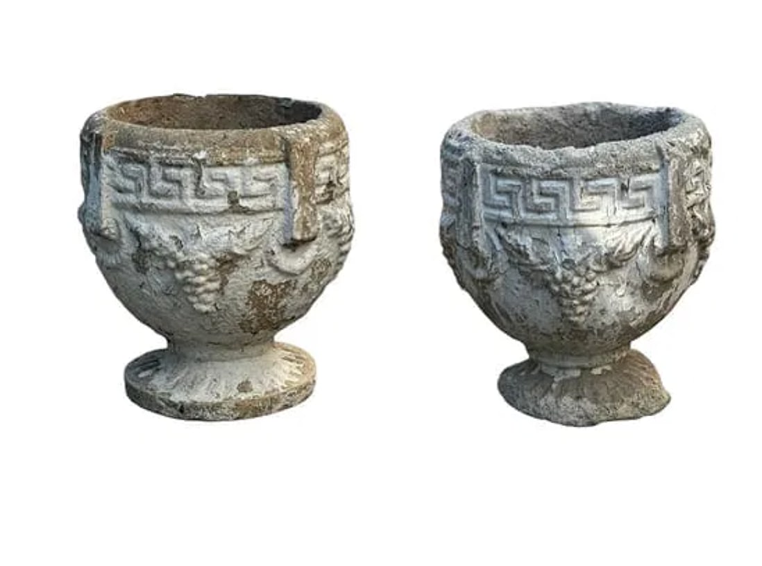 A pair of Greek key stone planters with a grape motif: A pair of Greek key stone planters with a grape motif. DIMENSIONS: 9"W x 9"D x 10.25"H