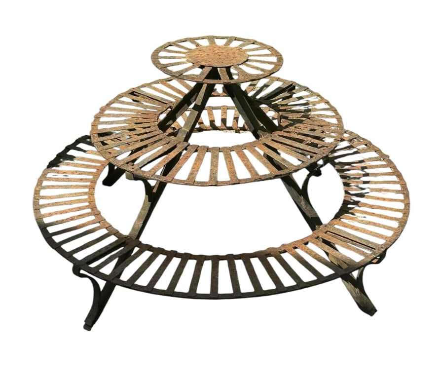 A rare pair of antique circular tiered iron garden stands: A rare pair of antique circular tiered iron garden stands. DIMENSIONS: 47.25"D x 26"H