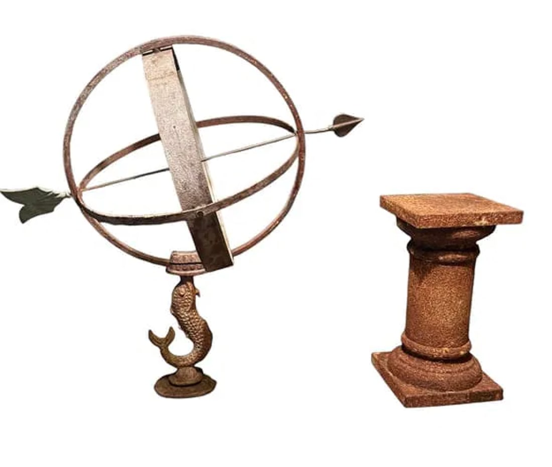A vintage dolphin armillary with a rusted pedestal stand: A vintage dolphin armillary with a rusted pedestal stand. DIMENSIONS: Armillary- 26.5"W x 16"D x 28.5"H. Stand- 8.5"W x 8.5"D x 16"H