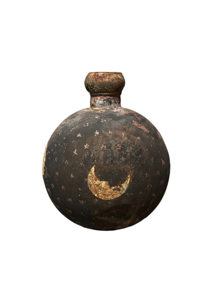 Vintage metal celestial vase: A vintage metal celestial vase. DIMENSIONS: 15"W x 15"D x 19"H