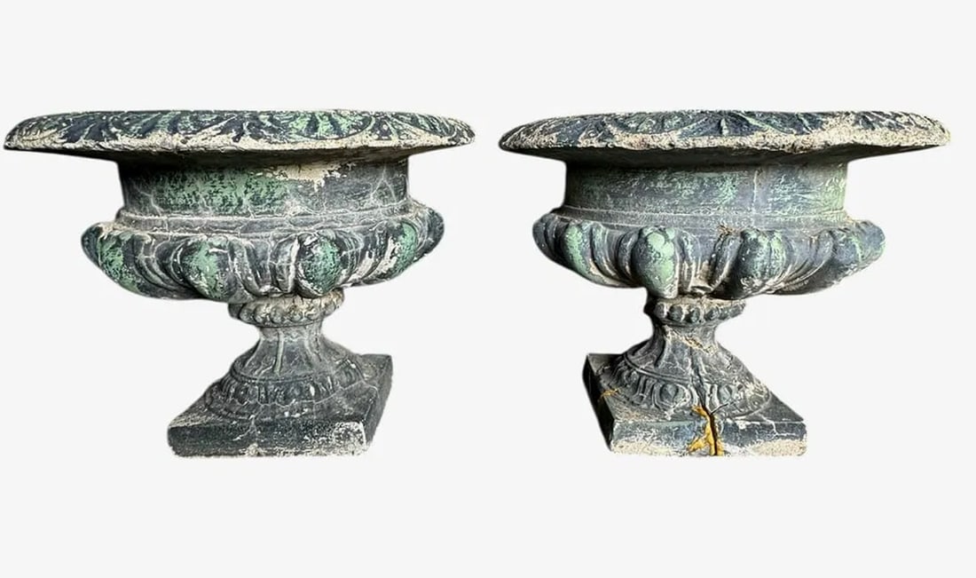 A pair of antique green garden urns: A pair of antique green garden urns. DIMENSIONS: 10"H x 6"D (BASE) x 12.5"D (TOP).