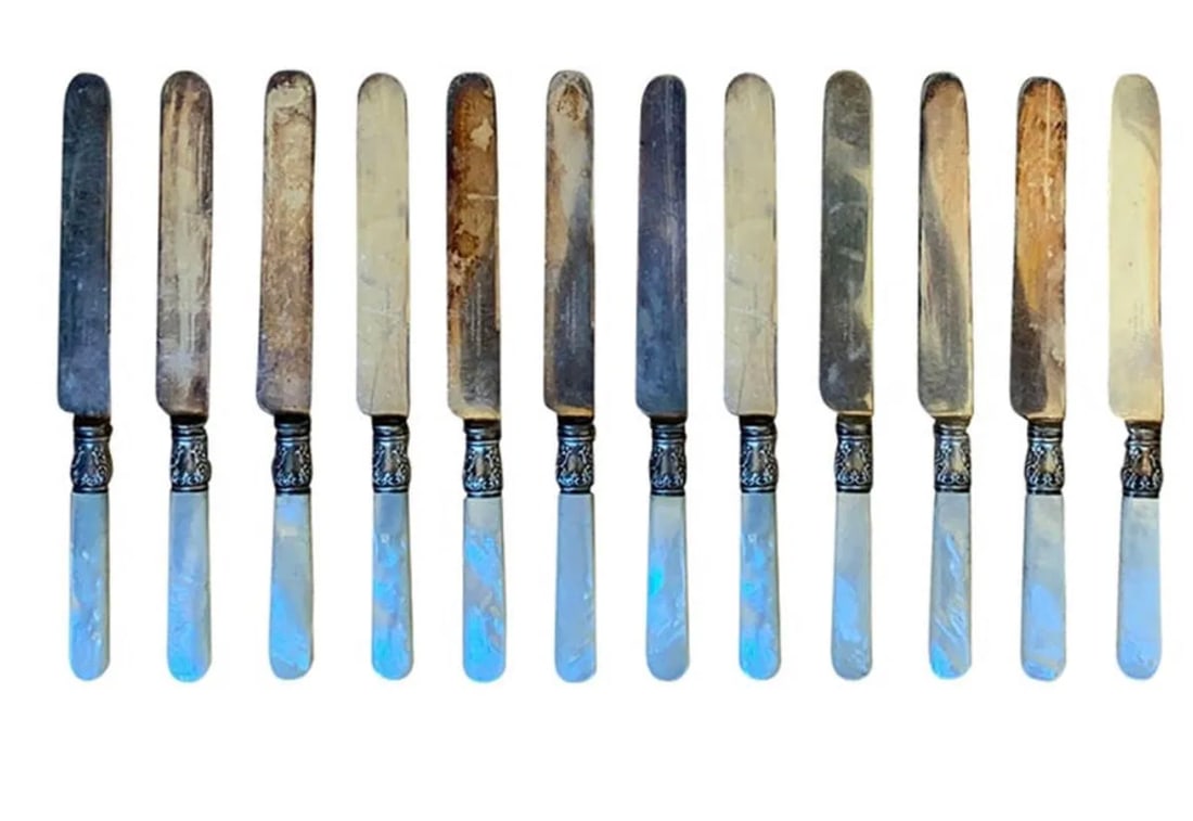 Set of 12 Antique mother-of-pearl knives: Set of 12 Antique mother-of-pearl knives. DIMENSIONS: 0.75"W x 0.5"D x 8"H