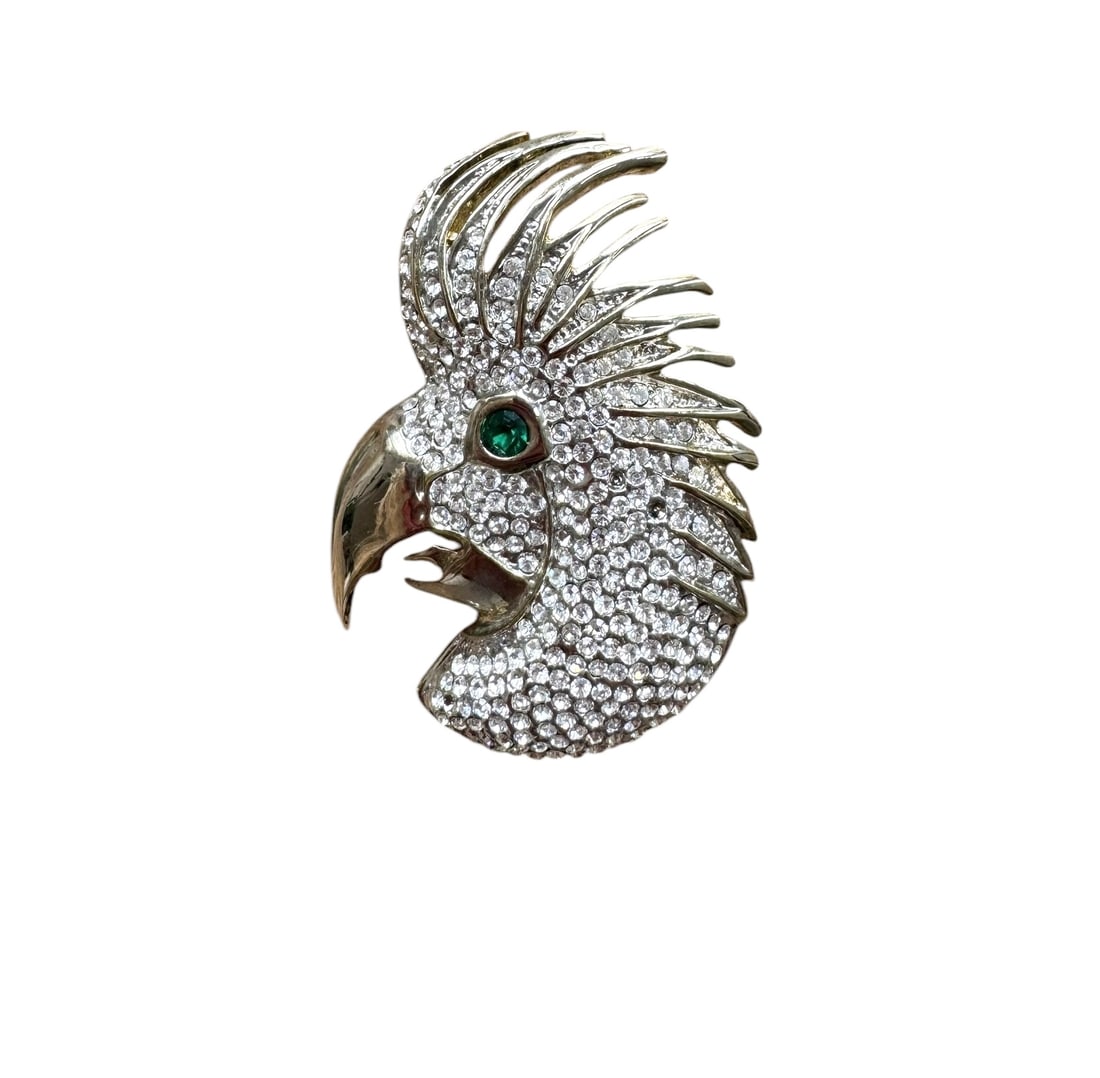 Vintage cockatoo brooch: A vintage diamante Cockatoo brooch with emerald eyes and a metal beak