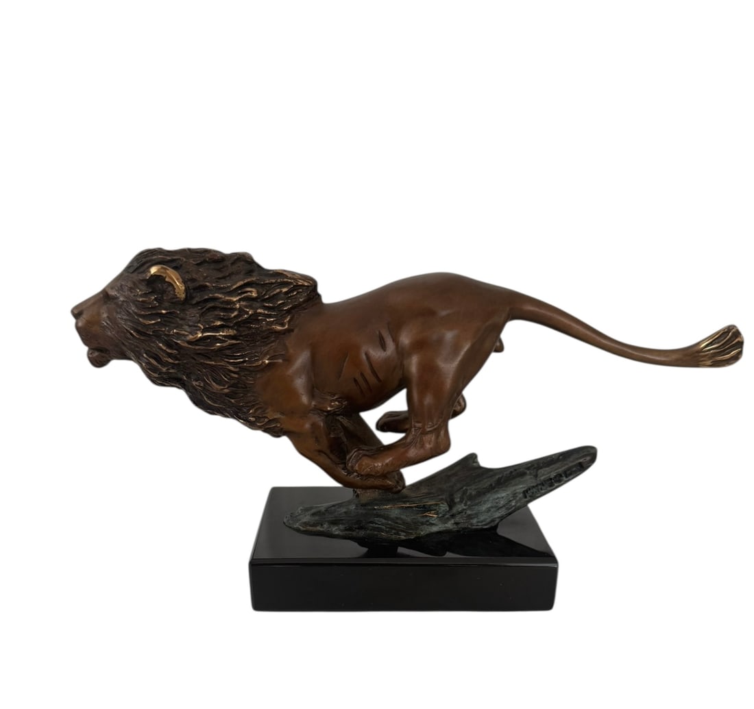 Bronze running lion statue: Bronze Running Lion Statue. DIMENSIONS: 8"L x 2.75"W x 4.5" H