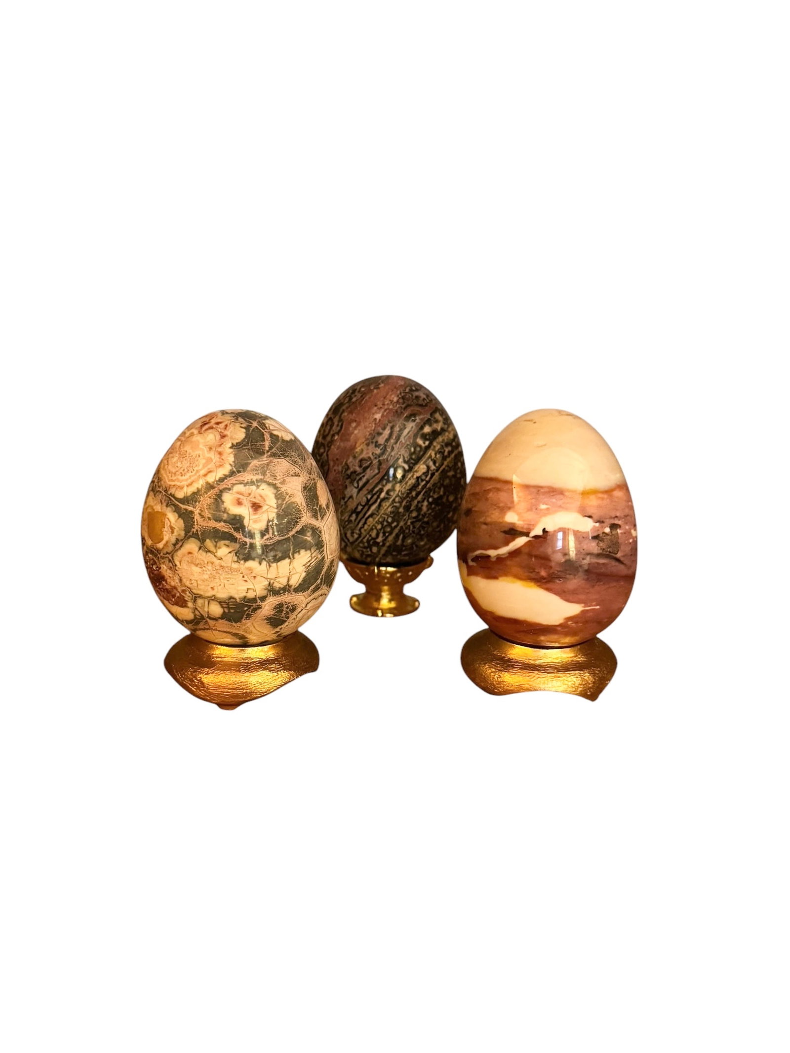 3 agate eggs: Set of 3 agate eggs on gilt brass stands. Each one slightly different.